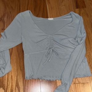 Light blue cropped top.